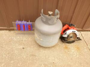 lot 15 image: 30 lb LP tank with new style valve & Tool Shop skil saw lightly used. Tested & works. As shown.