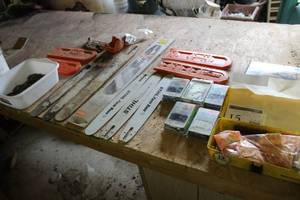 lot 15 image: Chainsaw Parts, Wen Lumberjack Electric Chain Saw Sharpener, Chains, Stihl Chain Bars and Chain Covers