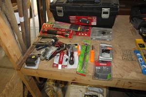 lot 379 image: Husky 24 Tool Box with Metal Handle, Misc. Hand Tools - Pliers, Flashlight, 33-piece Security Bit set, Screwdriver Set, Tire Gauge, Stihl Oilomatic