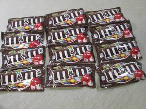 lot 73 image: 12 Bags of M&Ms Best by Aug 2020  ...