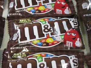 lot 74 image: 12 Bags of M&Ms Best by Aug 2020  ...