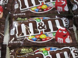lot 75 image: 12 Bags of M&Ms Best by Aug 2020  ...