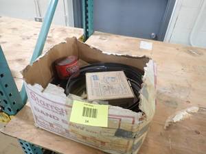 box of bansaw blades with grease and glove