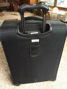 lot 144 image: Travelpro Suitcase