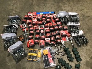lot 38 image: MIXED ASSORTED BIN FULL WITH MILWAUKEE TAPE MEASURES & DEWALTHUSKY TOOLS AND 8 4PK  4 in. Industrial Casters for carts SEE PICS
