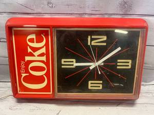 lot 22 image: Antique Enjoy Coke Starburst Clock 13 x 21 (working condition)