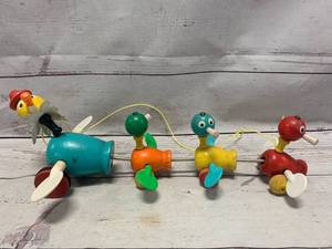 lot 34 image: Vintage Fisher Price Momma Duck Wood Pull String Toy
