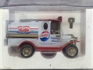 lot 55 image: Golden Wheel Pepsi Cola Diecast Bank & Key