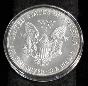 1987 AMERICAN SILVER EAGLE 1 TROY OZ. .999 FINE SILVER IN AIRTITE