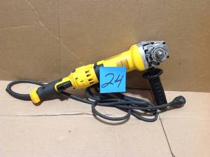 lot 24 image: DEWALT 13 Amp Corded 4-12 in. Angle Grinder missing parts please review the photos power on