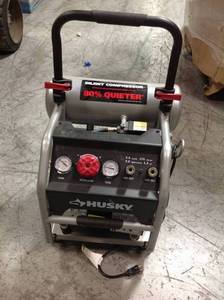 Husky 4.5 Gal. Portable Electric-Powered Silent Air Compressor in working conditions