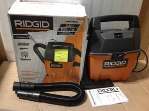 lot 32 image: RIDGID 3 Gal. 3.5-Peak HP Portable WetDry Shop Vacuum with Built-in Dust Pan, Filter, Expandable Hose and Car Nozzle &nbspin good condition 