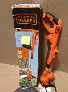 lot 73 image: BLACKDECKER 14 in. 6.5 Amp Corded Electric String Trimmer &nbspin good condition 