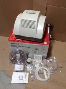 lot 100 image: Honeywell Home Powered Flow-Through Whole House Humidifier