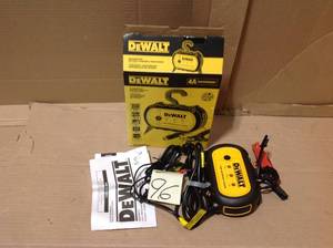 lot 96 image: DEWALT 4 Amp Professional Waterproof Battery Charger in good condition 