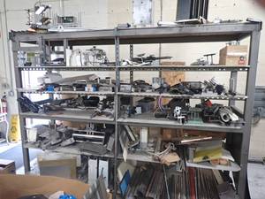 Heavy Duty metal rack on wheels ,includes everything on it, motors and lots of tooling and dies, unique metal