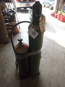pair of high pressure tanks, appear to be full, includes cart OXYGEN & ACETYLENE