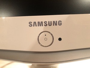 lot 133 image: White Samsung TV with Remote