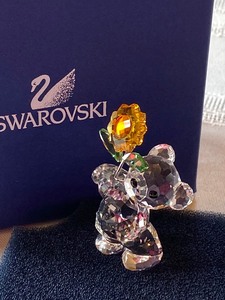 lot 84 image: Swarovski Small Bear with Flower