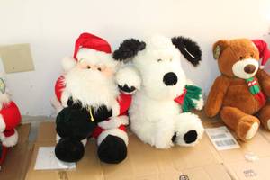 lot 75 image: Santa Claus Plush Toy, Black & White Dog Plush Toy