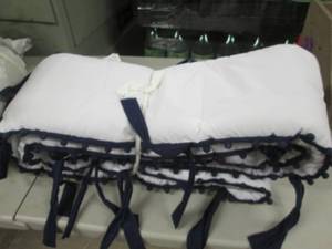 lot 251 image: Pottery Barn Organic Pom Pom Bumper...