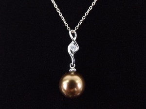 lot 19 image: .925 Sterling Silver Crystal Accented Copper Ball Pendant Necklace