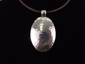 lot 36 image: .925 Sterling Silver Large Hand Hammered Shield Pendant and Leather Necklace