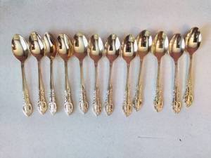 lot 34 image: Gold-Tone Flatware Set