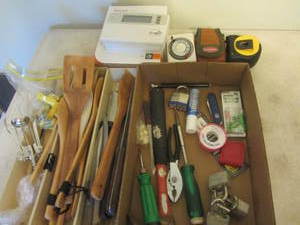 Kitchen drawer of utensils, knives,...