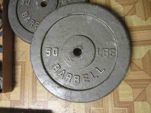 Barbell & two 50lb weights, two 3lb...