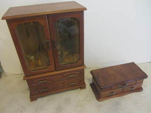 Two jewelry boxes with jewelry...
