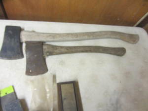 Two axes, several sharpening stones...