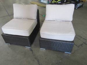lot 330 image: Set of 2 Noble House Nolan Multi Brown Wicker Armless Middle Outdoor Chair with Beige Cushions - One Cushion Needs Some Sewing Attention.
