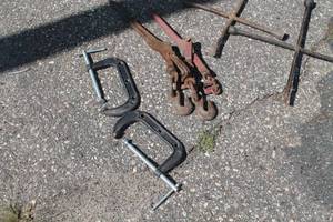 lot 20 image: Ratchet Chain Binders, 2 Metal Clamps And Tire Tool