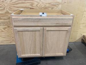lot 41 image: Project Source 36-in W x 35-in H x 23.75-in D Natural Unfinished Door and Drawer Base Stock Cabinet Oak Face