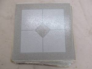 Self adhesive tile