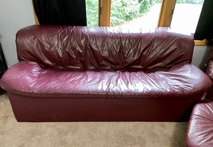 lot 135 image: Maroon Pleather Sofa, Arm Chair & Ottoman Set Great for a Dorm Room