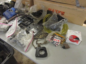 lot 468 image: RACING GO-KART PARTS, CHAINS, SPARK PLUGS, MUCH MORE