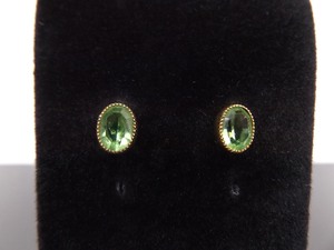 lot 58 image: 14k Yellow Gold Faceted Peridot Post Earrings