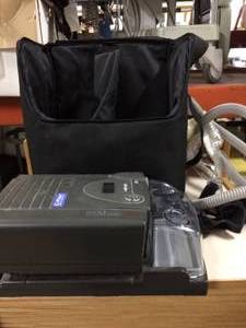 lot 12 image: MSRP $900&nbspRESPIRONICS REMSTAR PLUS CPAP WITH C-FLEXAND HEATED HUMIDIFIER, HOSE & CARRYING CASE - GOOD WORKING CONDITION