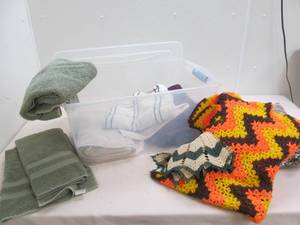 lot 107 image: Towels, pillow, afghan
