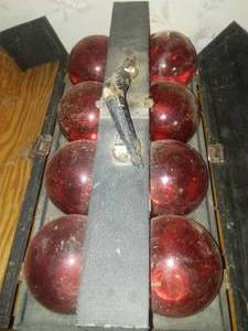 lot 573 image: Red Comet - For Fire Glass globe fireballs in case.