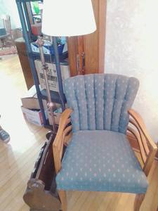 lot 122 image: Vintage armchair, floor lamp and magazine rack.