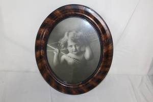 lot 149 image: Cupid  Framed Oval Print