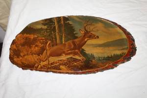 lot 64 image: Deer  Print on Oval Live Edge Tree Trunk