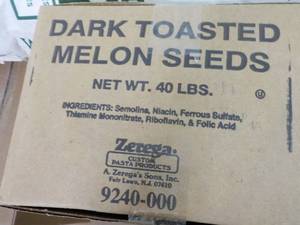 lot 234 image: 40 lb. Box Dark Toasted Melon Seeds...