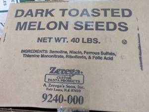 lot 235 image: 40 lb. Box Dark Toasted Melon Seeds...