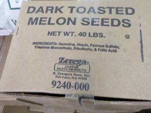 lot 236 image: 40 lb. Box Dark Toasted Melon Seeds...
