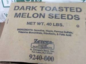 lot 237 image: 40 lb. Box Dark Toasted Melon Seeds...