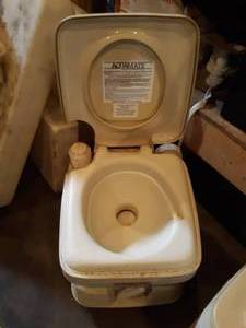 lot 16 image: New Old Stock porta potty for boat or camper.